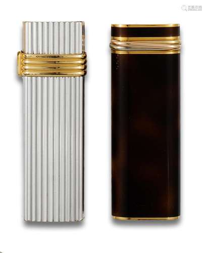 Lot of two lighters: CHRISTIAN DIOR in gold and Silver metal...