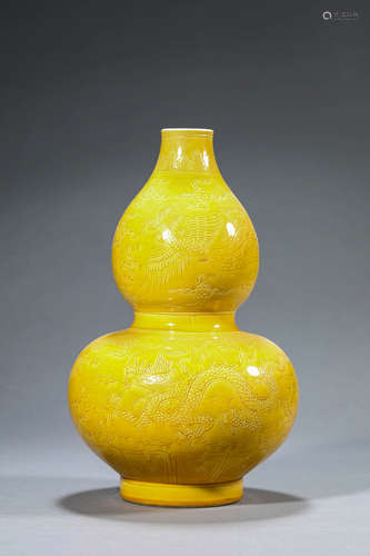 A dragon and phoenix carved yellow glazed porcelain gourd-sh...