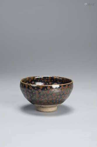 A black glazed brown spotted porcelain tea cup