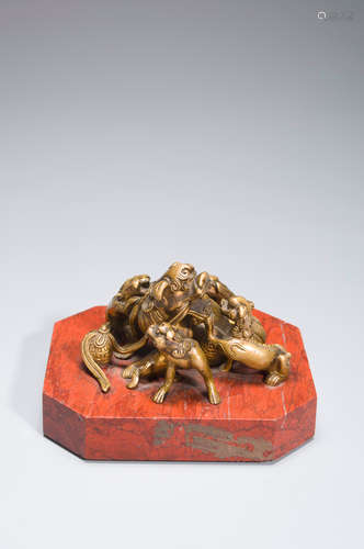 A copper lion paperweight