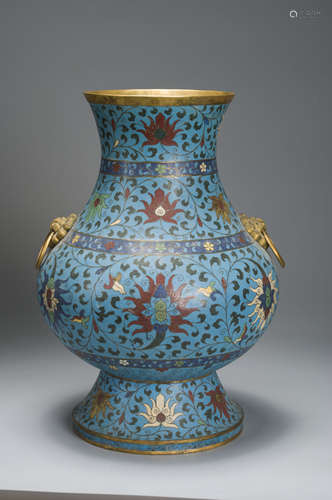 An interlocking lotus patterned cloisonne vase with beast sh...