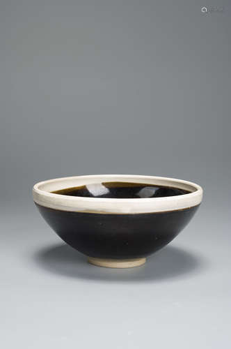 A black glazed porcelain bowl