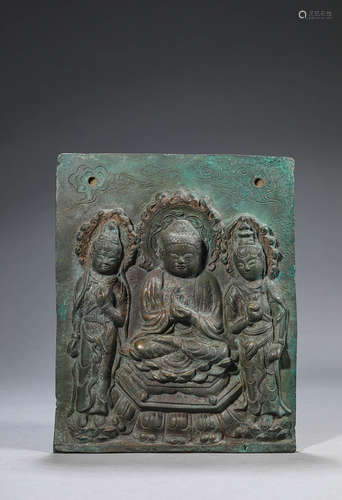 A copper buddha plaque