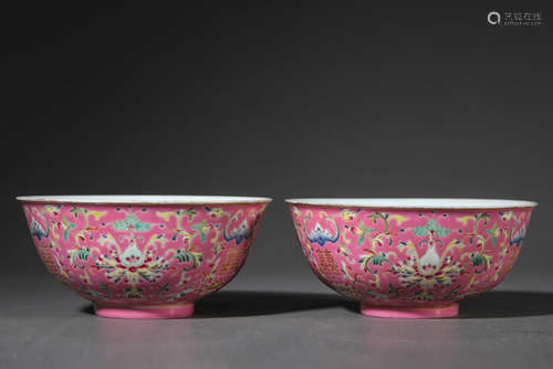 A pair of red ground famille rose interlocking lotus porcela...