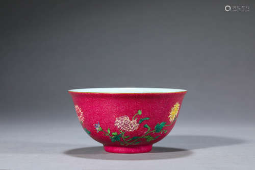 A red ground famille rose flower porcelain bowl