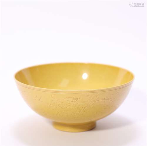 A dragon carved yellow glazed porcelain bowl