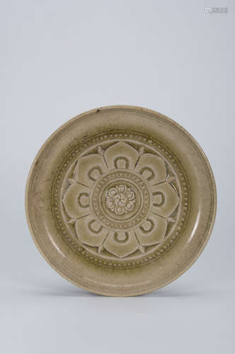 A flower carved celadon porcelain plate