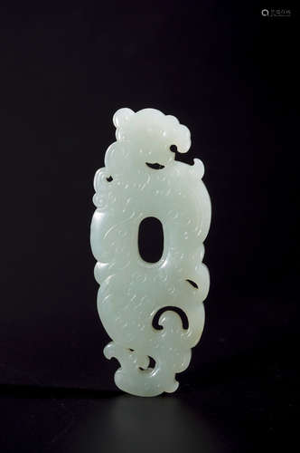 A white jade dragon pendant