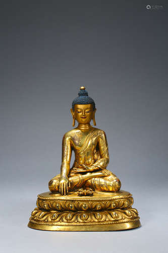 A gilding copper buddha statue