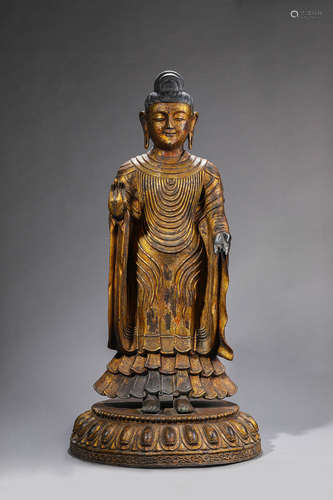 A gilt copper buddha statue