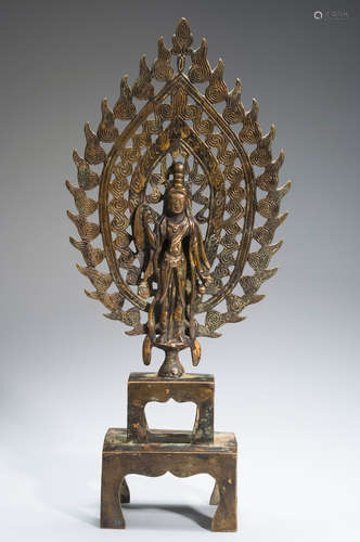 A copper Guanyin statue