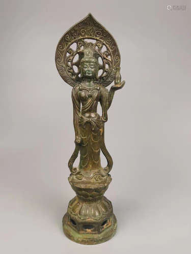 A copper Guanyin statue