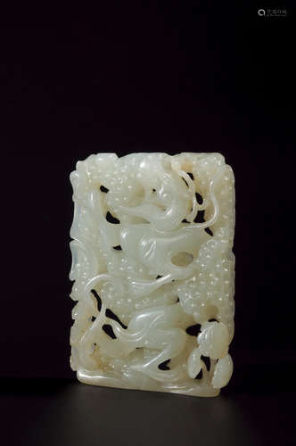 A white jade dragon pendant