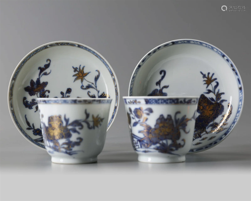 A PAIR OF CHINESE BLUE AND WHITE 'PEONY' CUPS AND ...