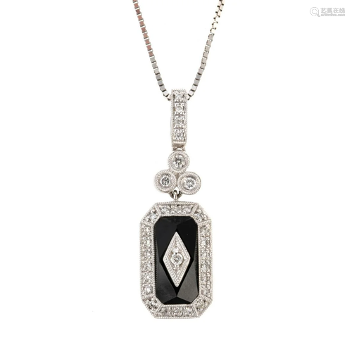 A Diamond & Black Onyx Pendant & Chain in 14K