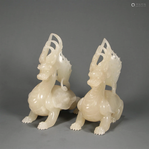 A Pair of Carved Hetian Jade Ornaments