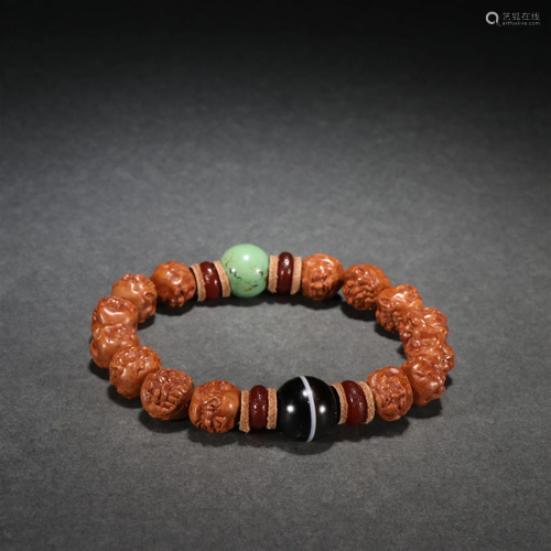 A Carved Walnut Arhat Bead Bracelet