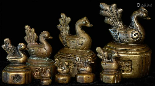 A wonderful set of eight 19thC chicken opium weights.