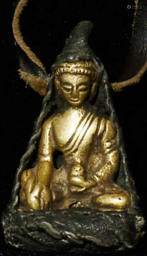 This buddha, encased in leather is 1.75" tall, and