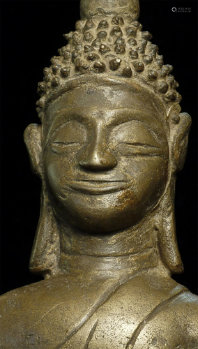 Delightful Laos Bronze Buddha with a delightful smile.