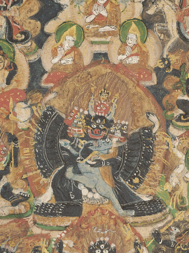 An elaborate antique Mongolian Thangka in a wooden