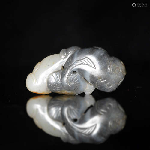 A Chinese black and white jade carving of a pair of catfish ...