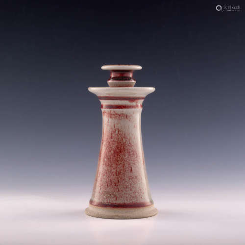 A Chinese red-glazed candlestick  19th century 十九世紀 紅釉...