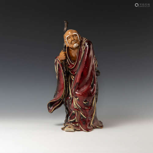 A Chinese Shiwan figure of Long-Eyebrow Luohan  Mid-20th cen...