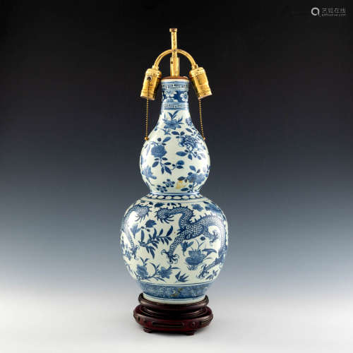 A Chinese blue and white double gourd dragon vase mounted as...