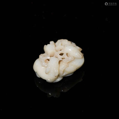 A Chinese mutton fat jade carving of three goats eating ling...