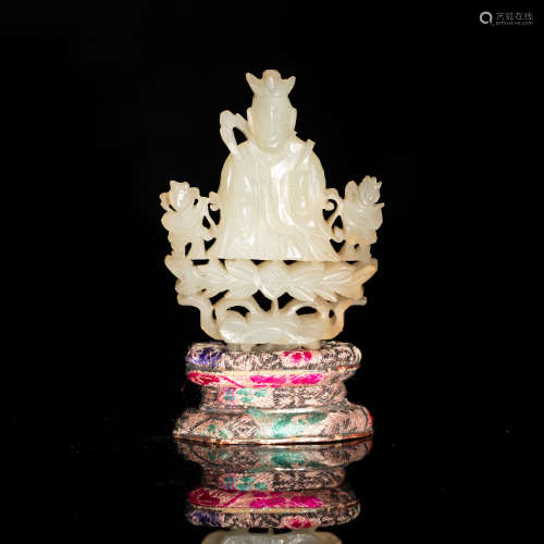 A Chinese pierced jade carving of Guanyin with two attendant...