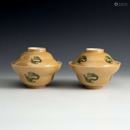 A pair of beige glazed dragon emblem cups with lids  Daoguan...