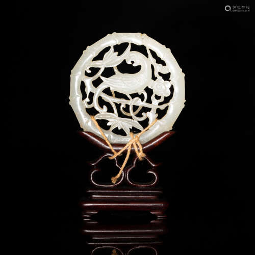 A Chinese carved jade plaque with parrot on a wooden stand  ...