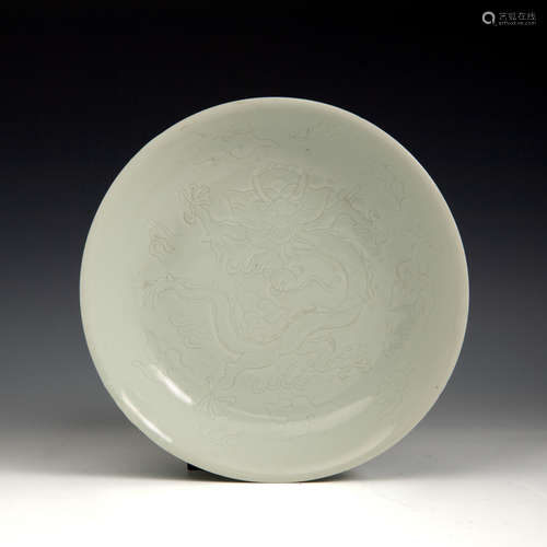 A Chinese white glazed plate incised with dragons  19th cent...