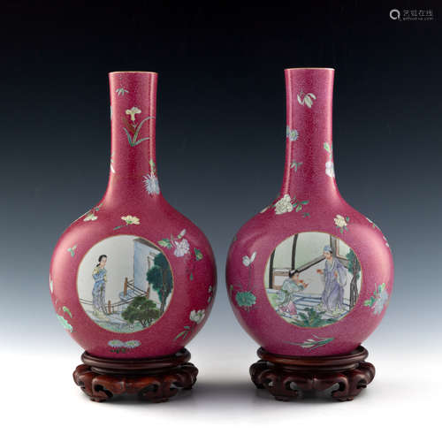 A pair of Chinese ruby red ground famille rose incised vases...