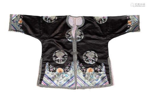 A Chinese black ground lady's robe with phoenix medallions  ...