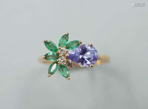 Bague fleur en or rose 18k sertie d'une tanzanite taille poi...