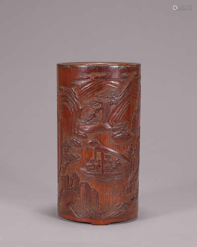 A figure carved bamboo brush pot