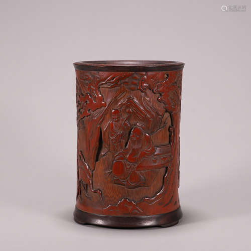 A figure carved bamboo brush pot