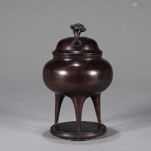 A red sandalwood three-legged incense burner