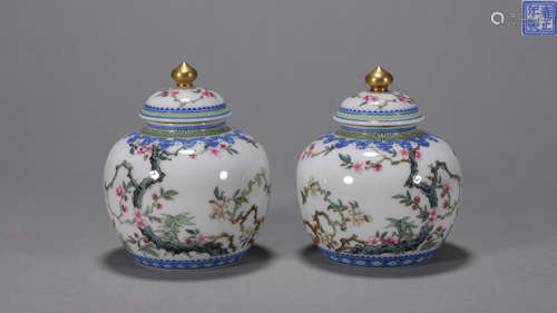 A pair of famille rose flower and bird porcelain jars