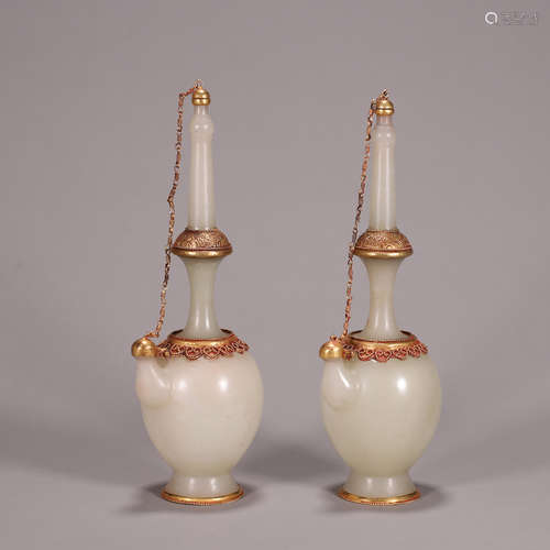 A pair of gold-inlaid jade pots