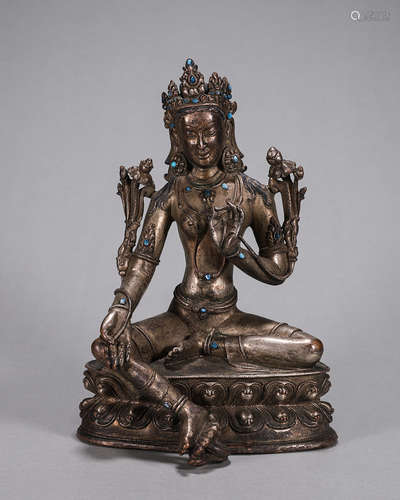 A copper green tara statue