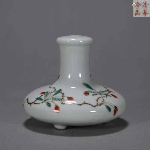 A multicolored flower and butterfly porcelain vase