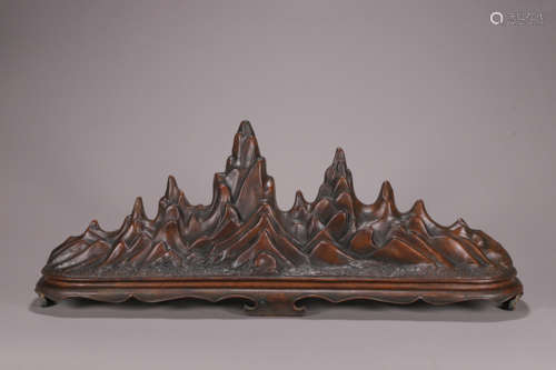 A copper brush stand