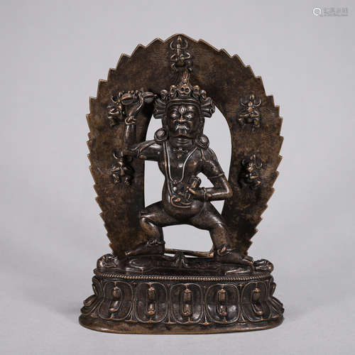 A silver-inlaid copper buddha statue