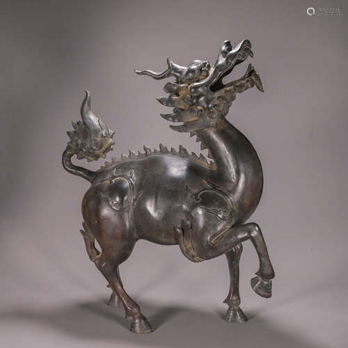 A copper qilin ornament