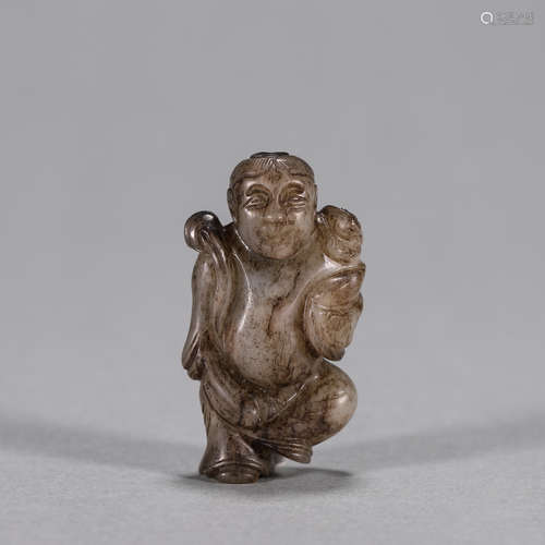 A jade figurine pendant