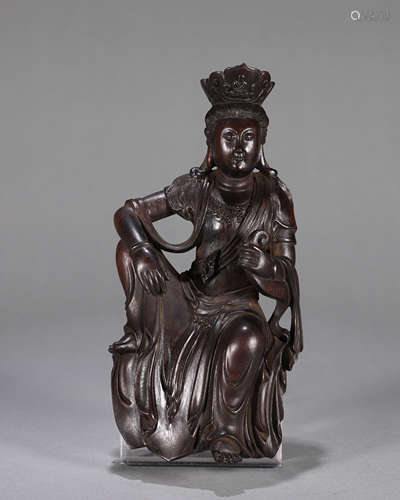 A red sandalwood Guanyin statuette