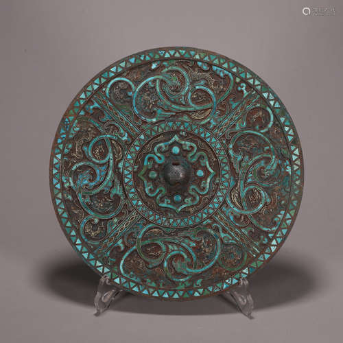 A beast patterned turquoise-inlaid bronze mirror